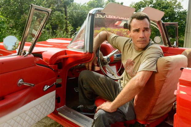 Carlos in his '56 ThunderbirdPhotographer: Michael Coles